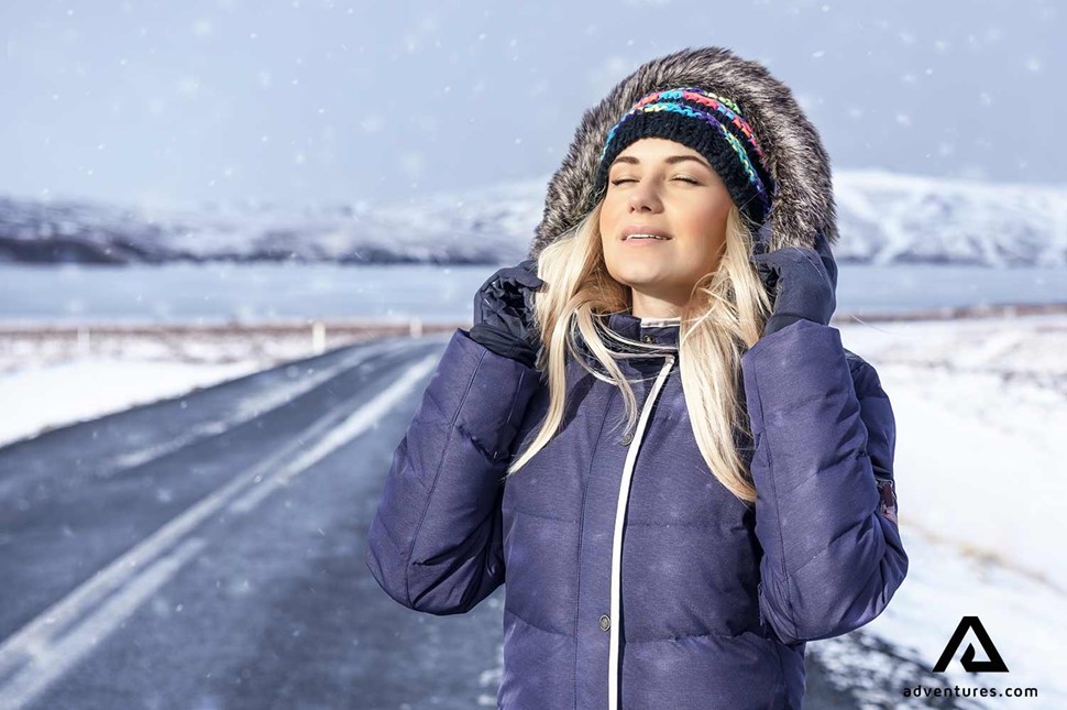 woman with a winter jacket in iceland