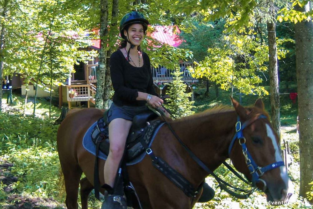 Happy woman on a horse