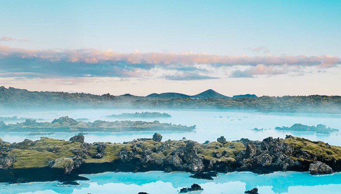 lava rock formations and blue lagoon in iceland