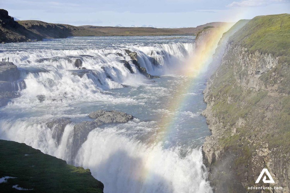 rainbow over powerful gullfoss waterfall