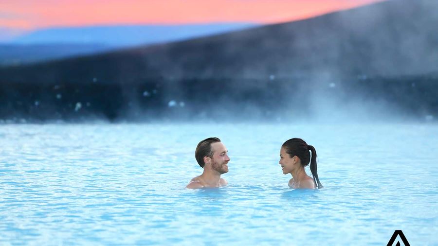 couple bathing in blue lagoon
