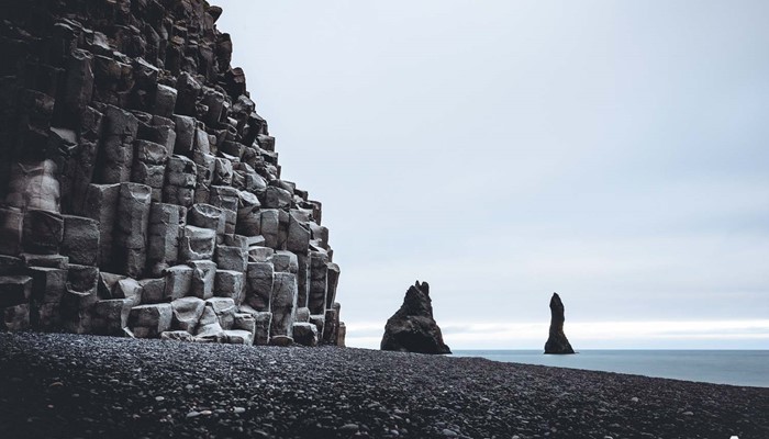 dark basalt columns in reynisfjara black sand beach