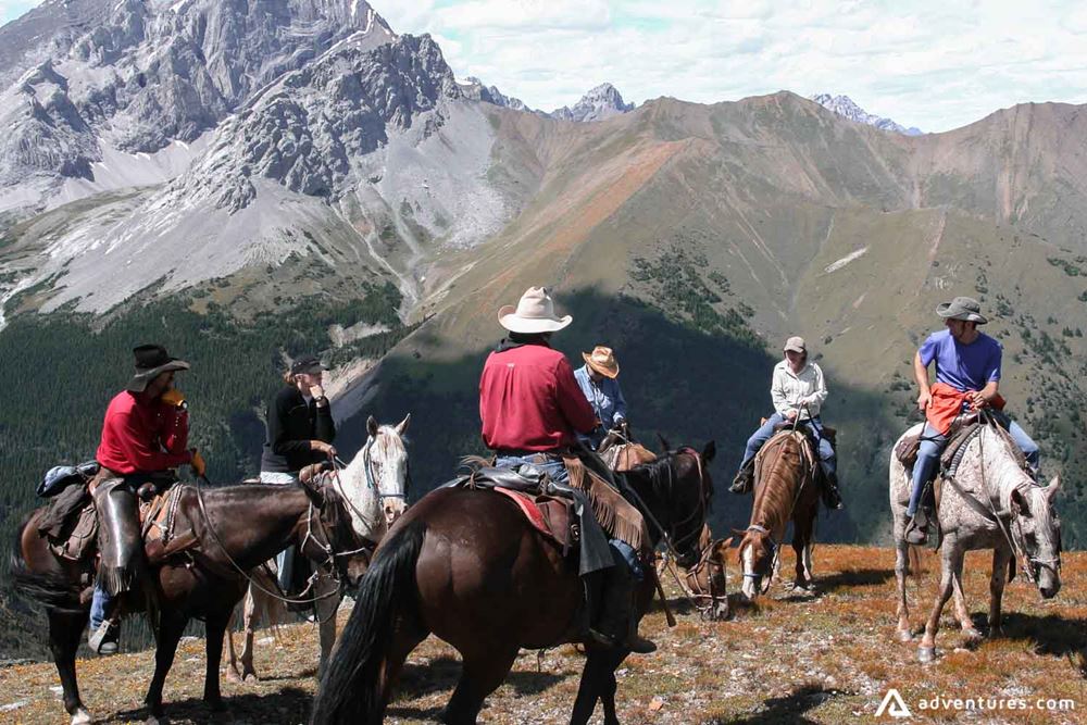 Tourists on a horseback tour in Canada