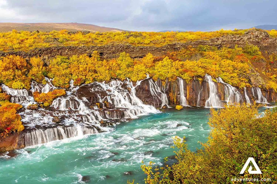 bright autumn view of hraunfossar waterfall