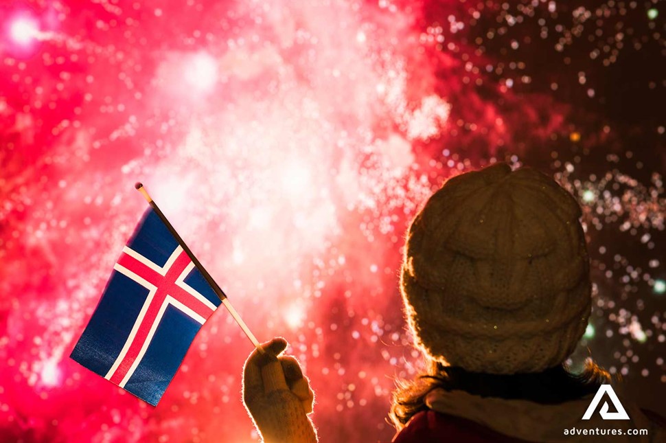 Waving Icelandic Flag New Years Fireworks in Iceland