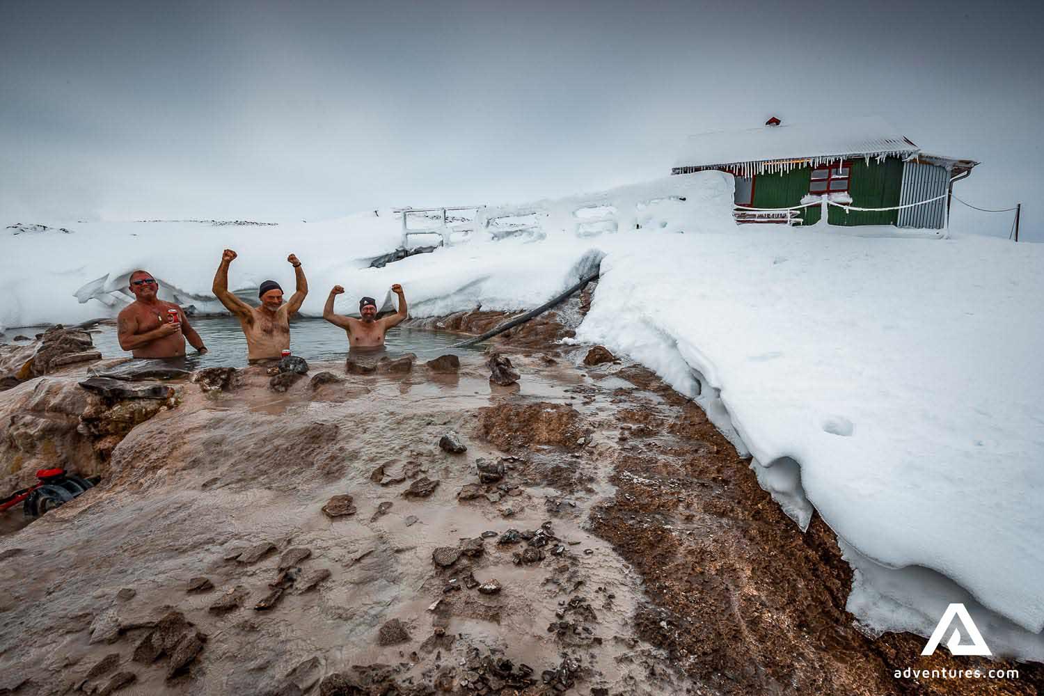 happy friends bathing in geothermal hot pool