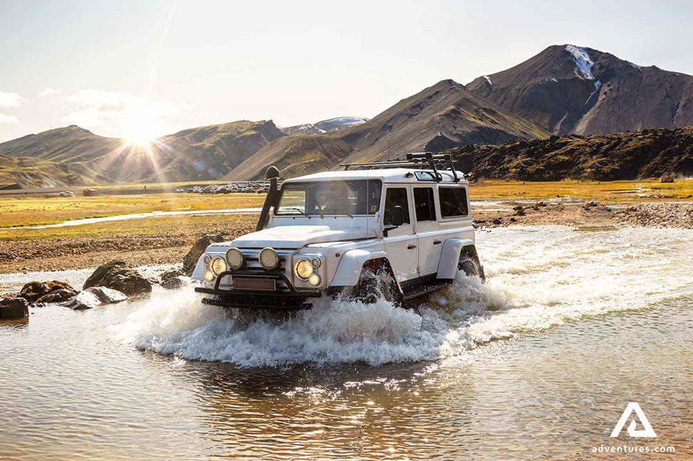 range rover crossing a river in iceland