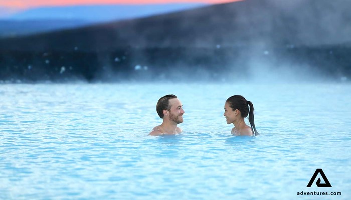 couple relaxing in the blue lagoon near grindavik