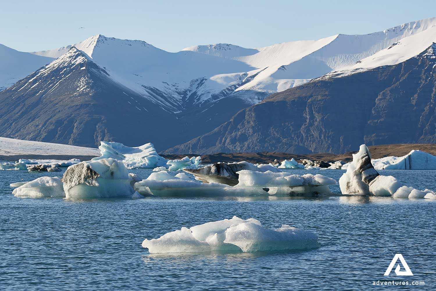 sunny day mountain range view at jokulsarlon in south iceland