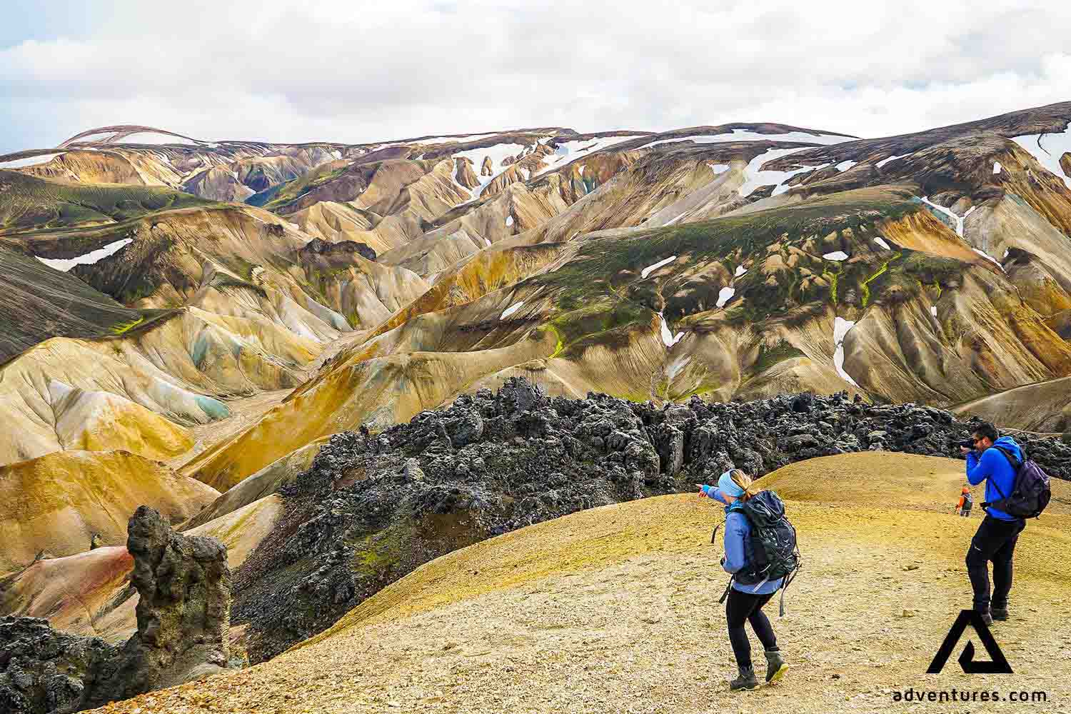 two friends hiking in landmannalaugar mountains