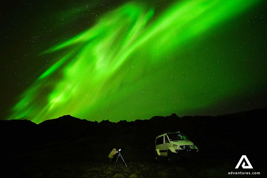 watching norther lights near a super jeep