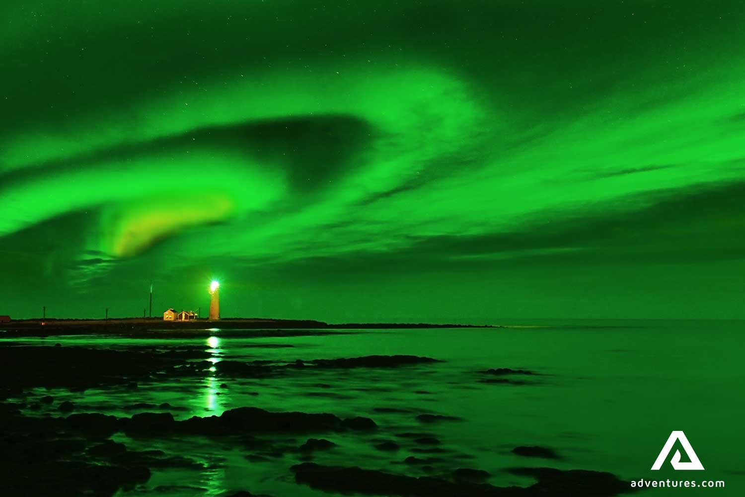 northern lights above grotta lighthouse in reykjavik
