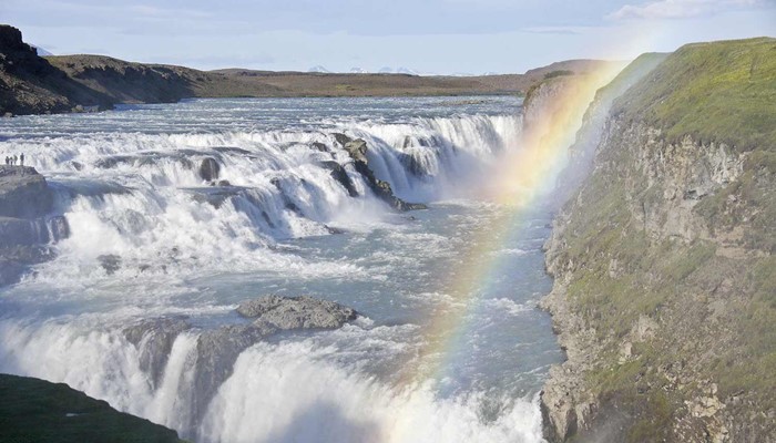 rainbow over gullfoss waterfall in iceland