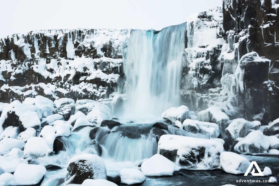 frozen oxararfoss waterfall in thingvellir