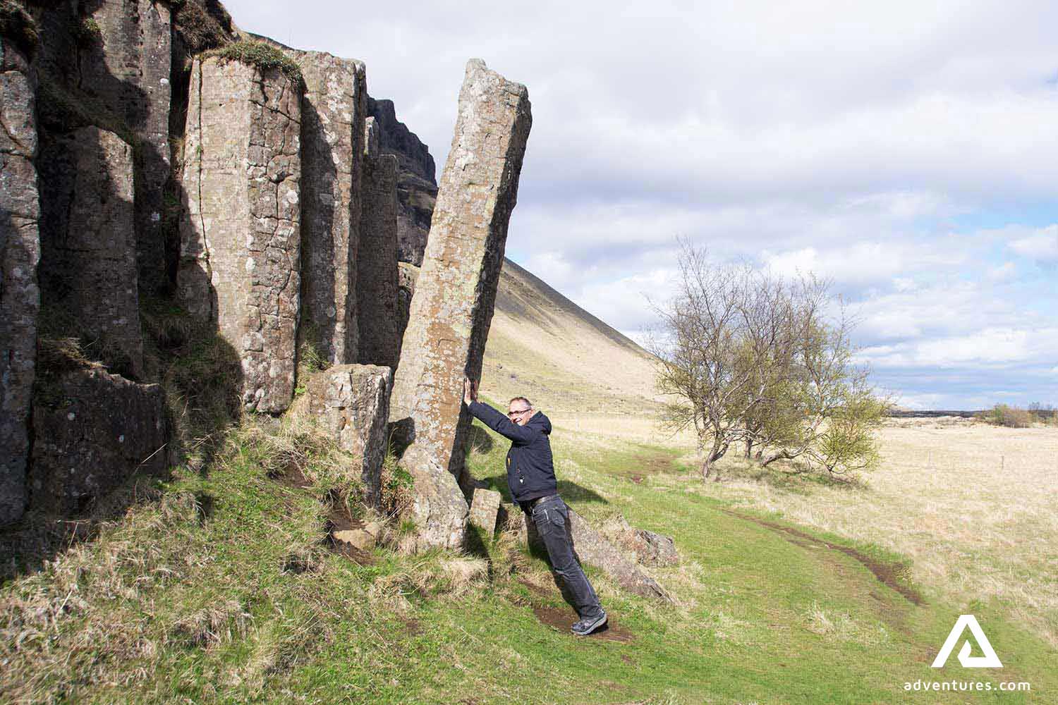 man next to Dverghamrar Cliffs in south iceland