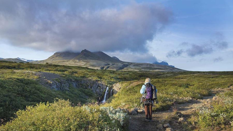 woman hiking towards svartifoss