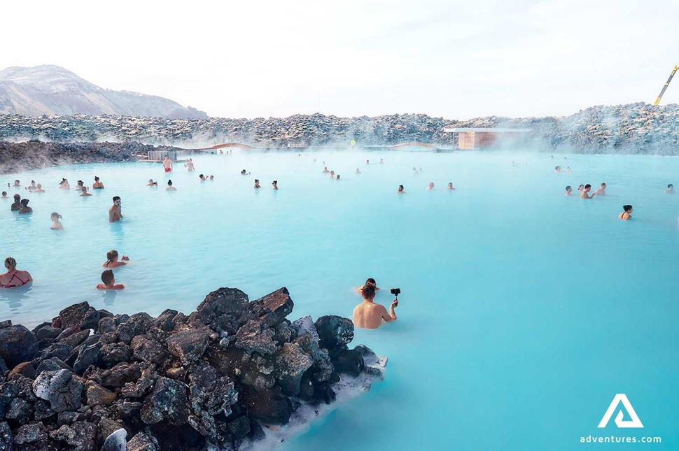 people bathing in the blue lagoon in reykjanes