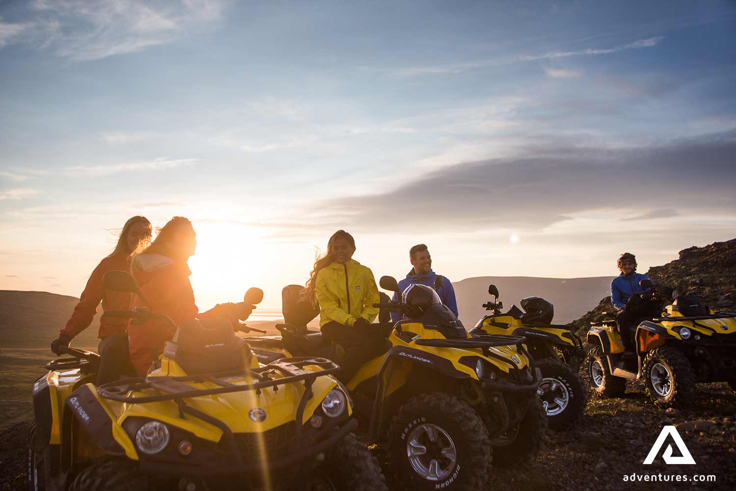 friends atv riding at sunset in iceland