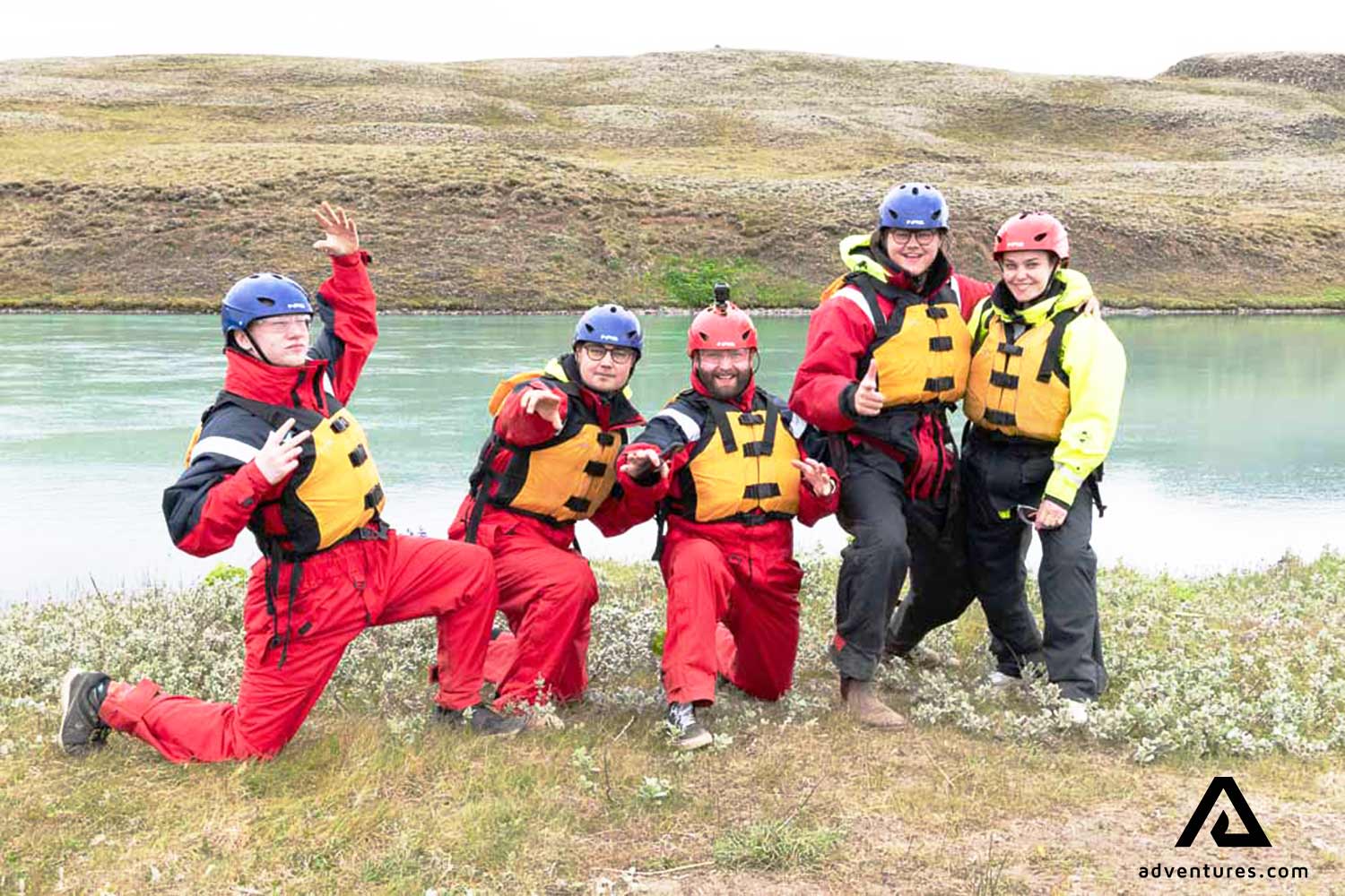 happy group posing before a rafting tour