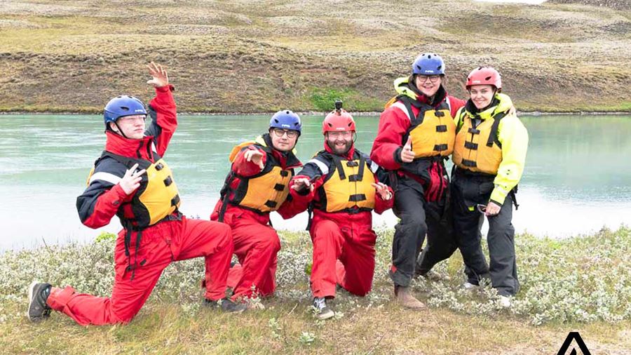 happy group posing before a rafting tour