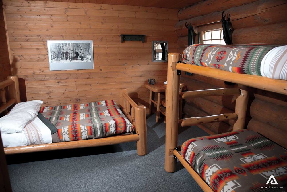 Bunk beds inside wooden lodge