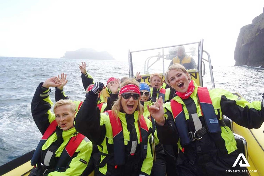 happy group on a fast rib boat