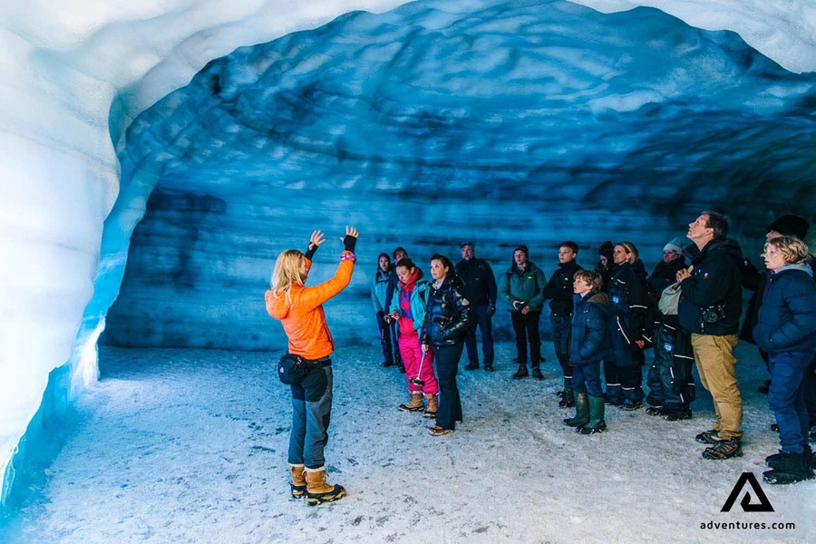 guide explaining inside an ice cave