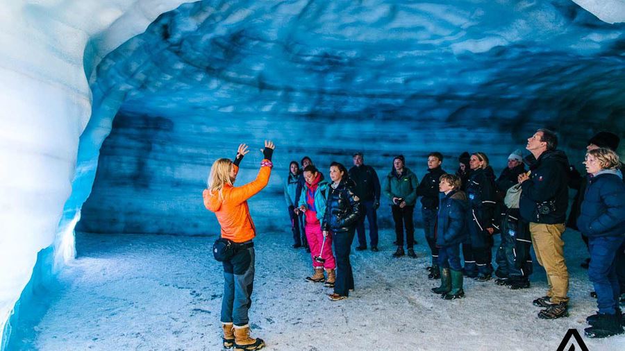 guide explaining inside an ice cave