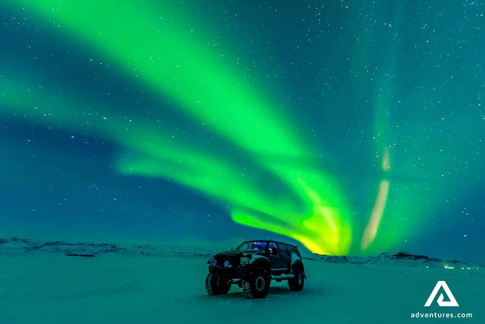 watching northern lights from a super jeep