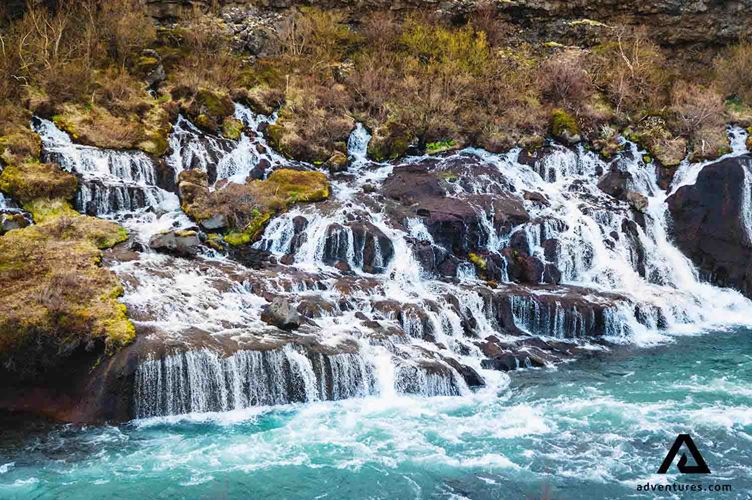 view of hraunfossar waterfall view of hraunfossar waterfall in iceland