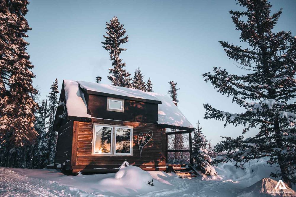 Beautiful snowy lodge in the forest