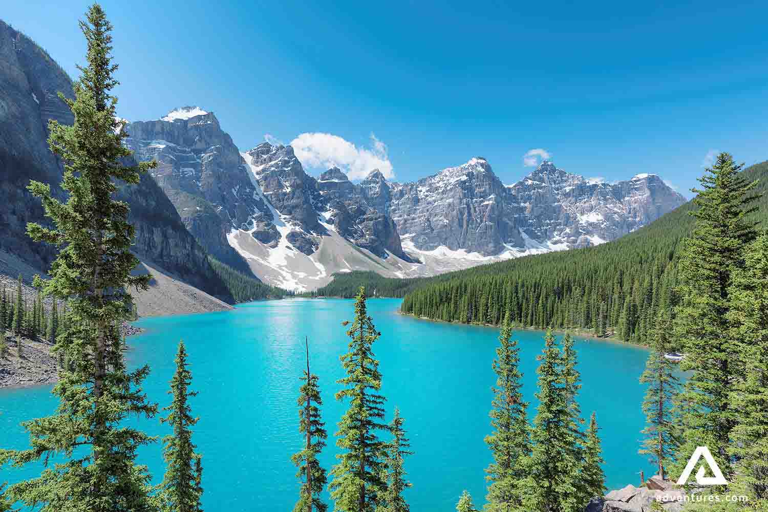 moraine lake in summer near a mountain range
