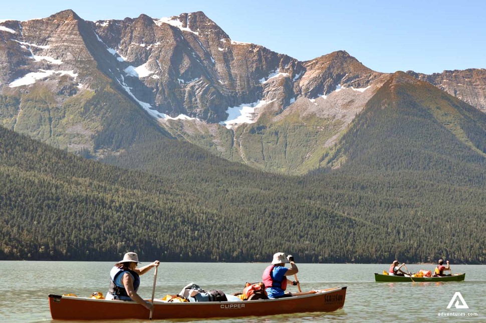 small group canoeing in bowron lakes in canada