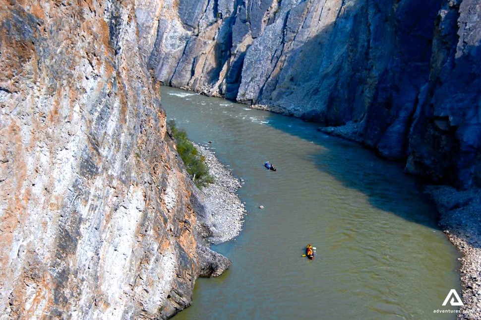 aerial view of people canoeing in a canyon
