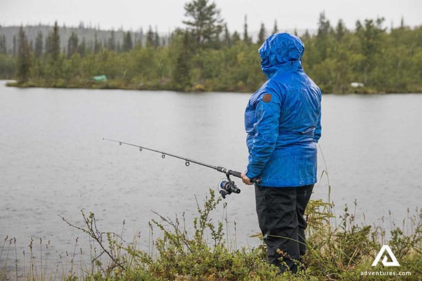 man fishing in karats lake in sweden