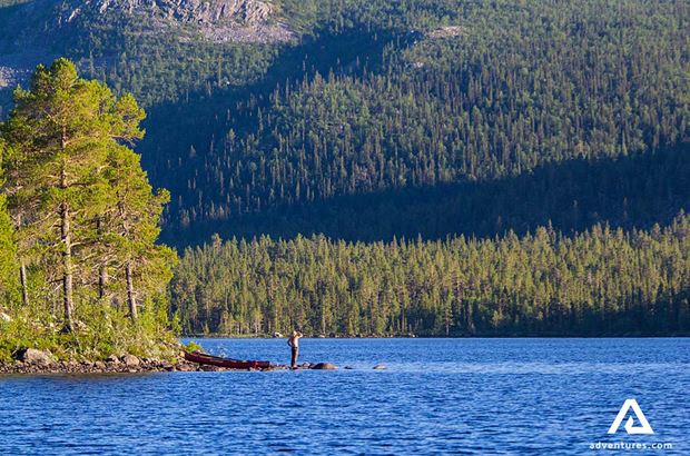 standing near pearl river with forest in the background standing near pearl river with forest in the background in sweden
