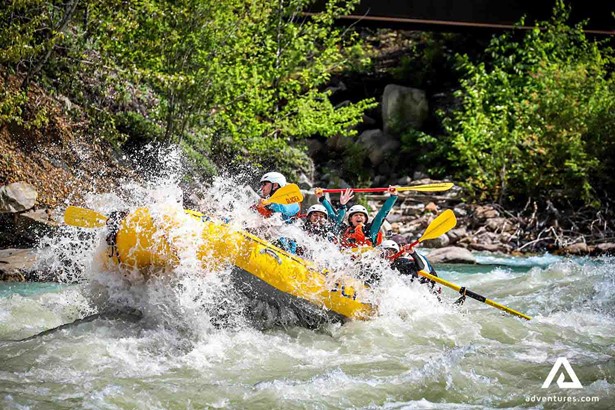 group rafting in a powerful stream river