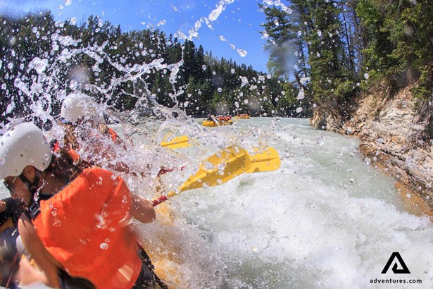 extreme rafting in a river with water splashing