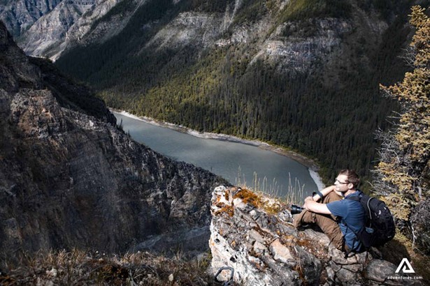 hiker enjoying nahanni river view in canada