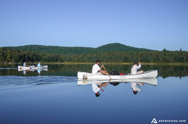 canoeing in a calm lake in canada