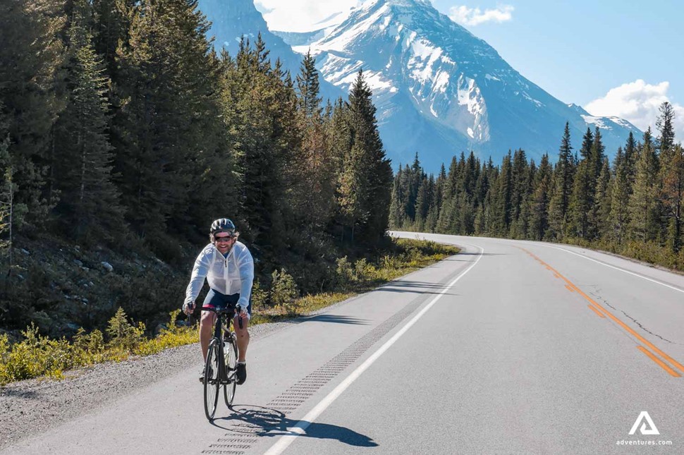 riding a bike down a mountain road in canada