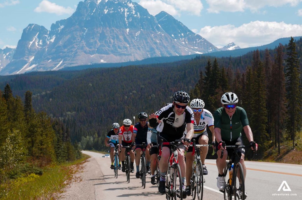 large group of cyclists in rocky mountain alberta