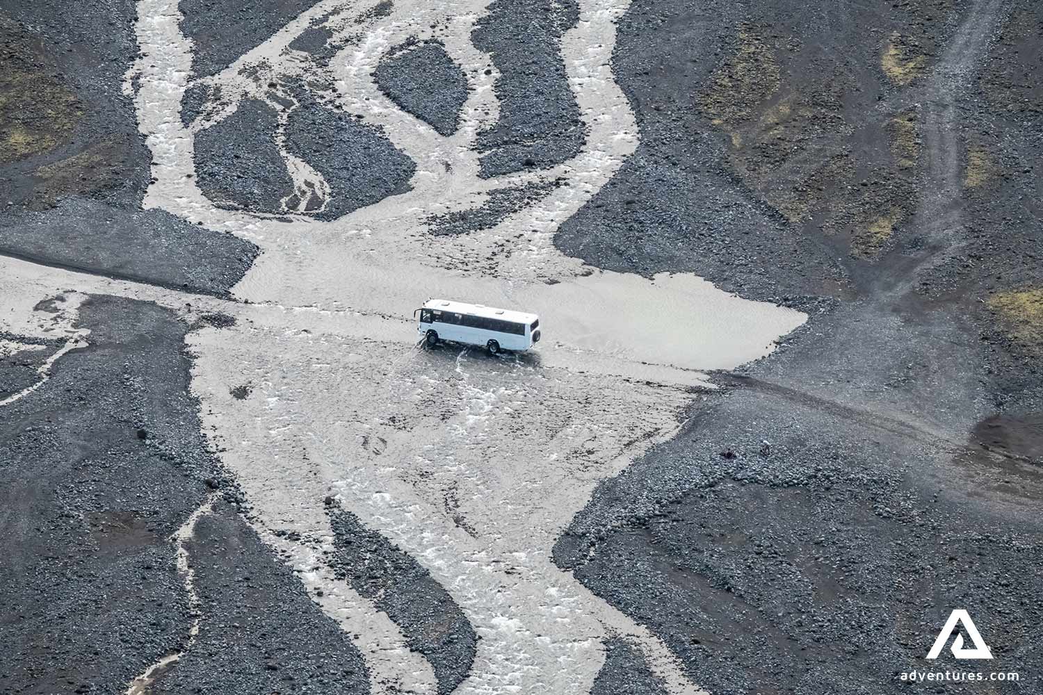 4x4 bus crossing a river in iceland