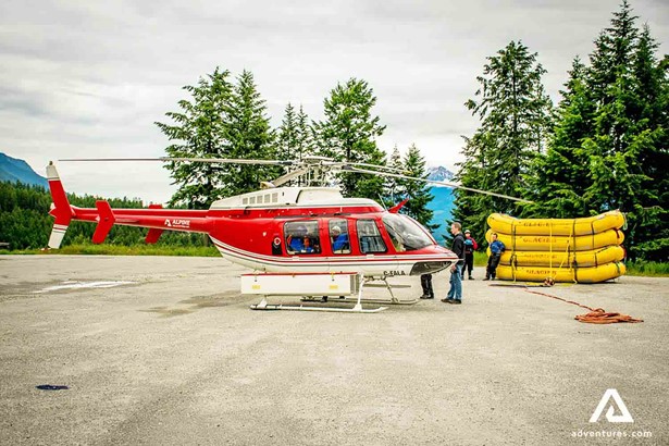 red helicopter in canadian rockies