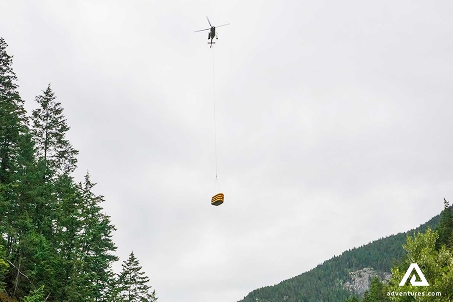 helicopter carrying rafts