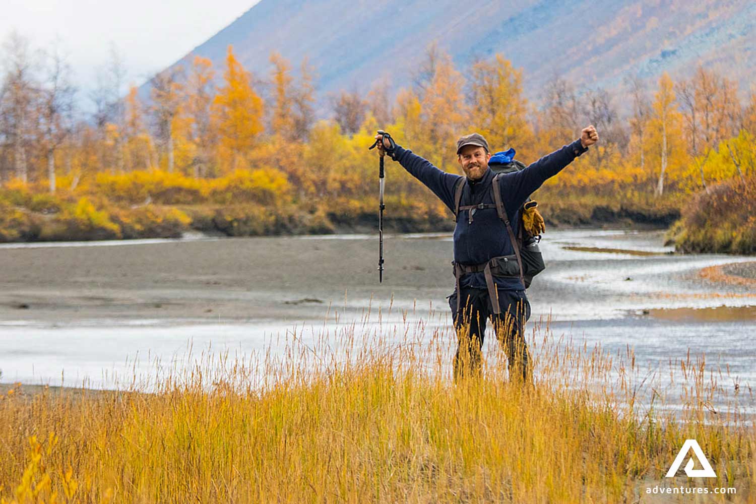 happy hiker spreading arms in sweden