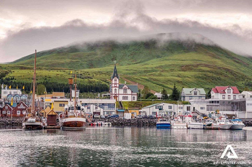 husavik town and harbor on a cloudy day
