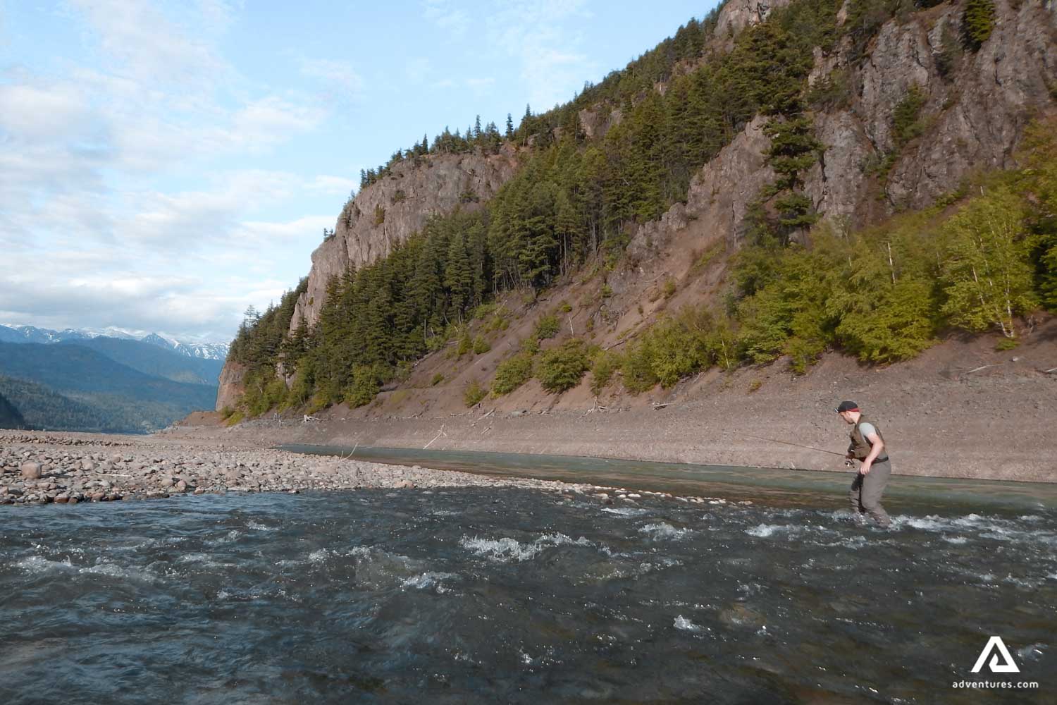 fly fishing in a river in canada at summer