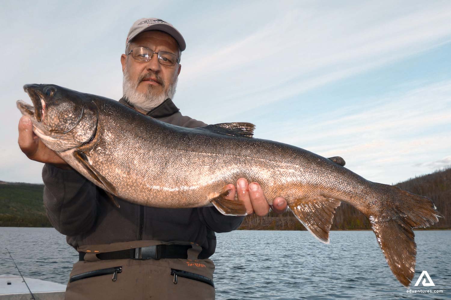 fisher with a large pike in canada