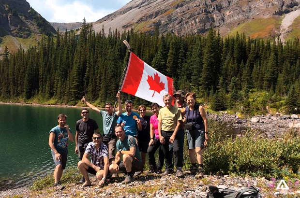 group of hikers with Canadian flag in yoho
